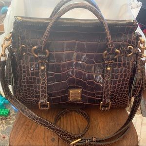 Dooney and Bourke brown zippered top satchel.